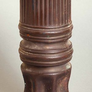 A grenade shell in the shape of a vase